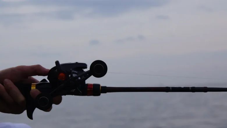 Boat tackle for tenya and tairaba laid out on the gunwale with the sea behind, representative of the premium Gamakatsu Sakuragen Tai Tenya X class